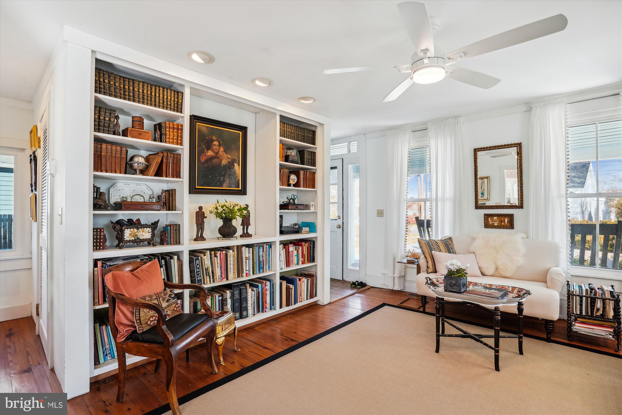 6394 Bozman Neavitt Road Neavitt, MD 21652 - Photo 2 of 26 a living room with furniture a bookshelf and a window