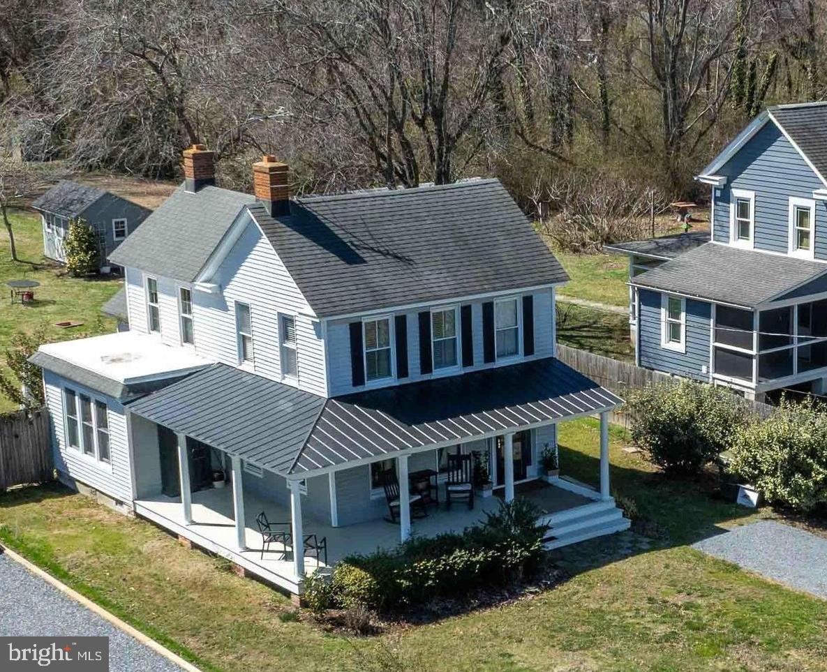 6394 Bozman Neavitt Road Neavitt, MD 21652 - Photo 24 of 26 an aerial view of a house with a yard table and chairs
