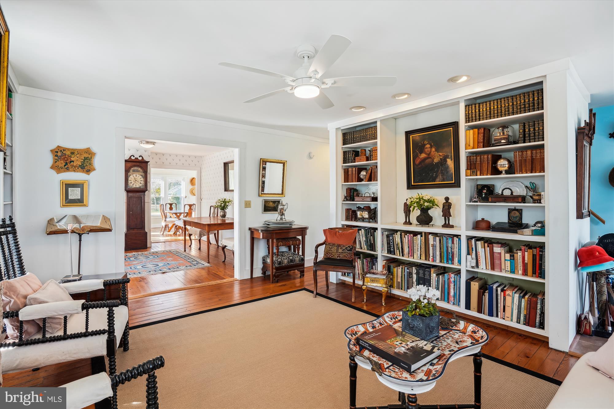6394 Bozman Neavitt Road Neavitt, MD 21652 - Photo 5 of 26 a living room with lots of furniture and book shelf