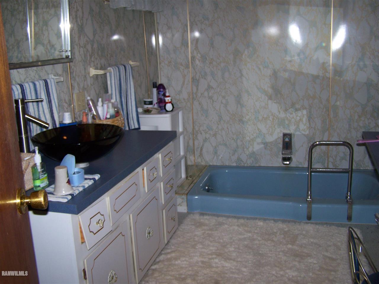 9554 Preston Road Mount Carroll, IL 61053 - Photo 11 of 17 a bathroom with a sink and a mirror