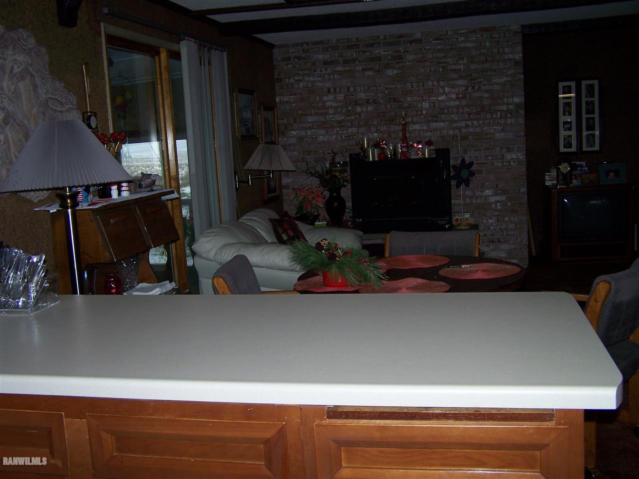 9554 Preston Road Mount Carroll, IL 61053 - Photo 3 of 17 a room with fireplace and a microwave