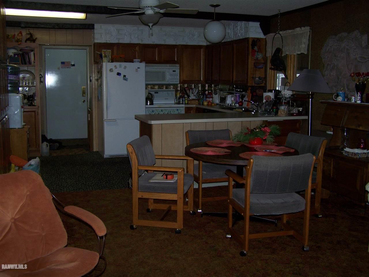 9554 Preston Road Mount Carroll, IL 61053 - Photo 4 of 17 a dining room with furniture and chandelier