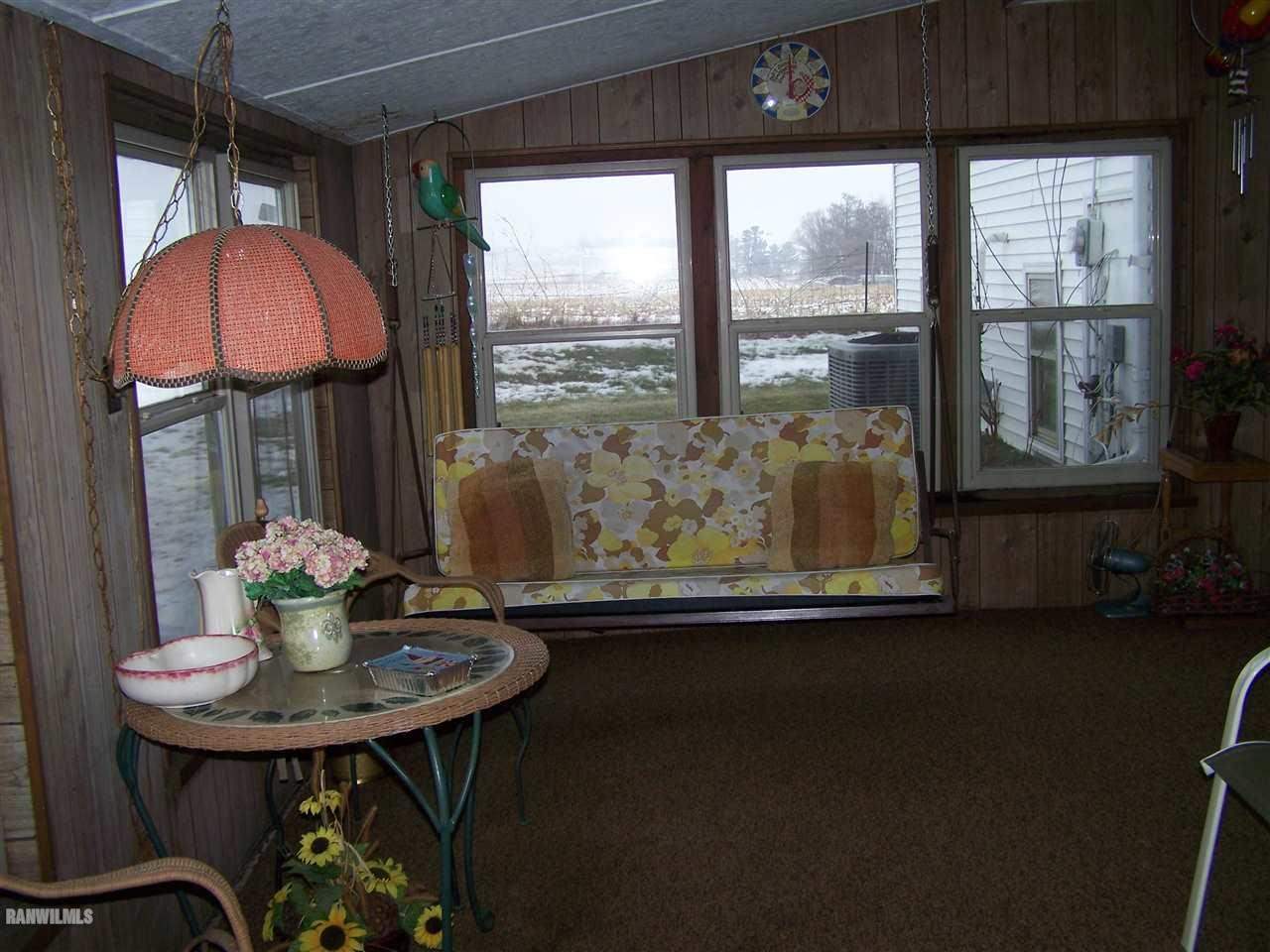 9554 Preston Road Mount Carroll, IL 61053 - Photo 5 of 17 a dining room with furniture and window