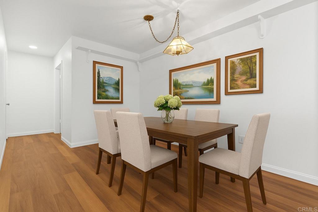13544 Comuna Drive Poway, CA 92064 - Photo 14 of 41 a view of a dining room with furniture and wooden floor
