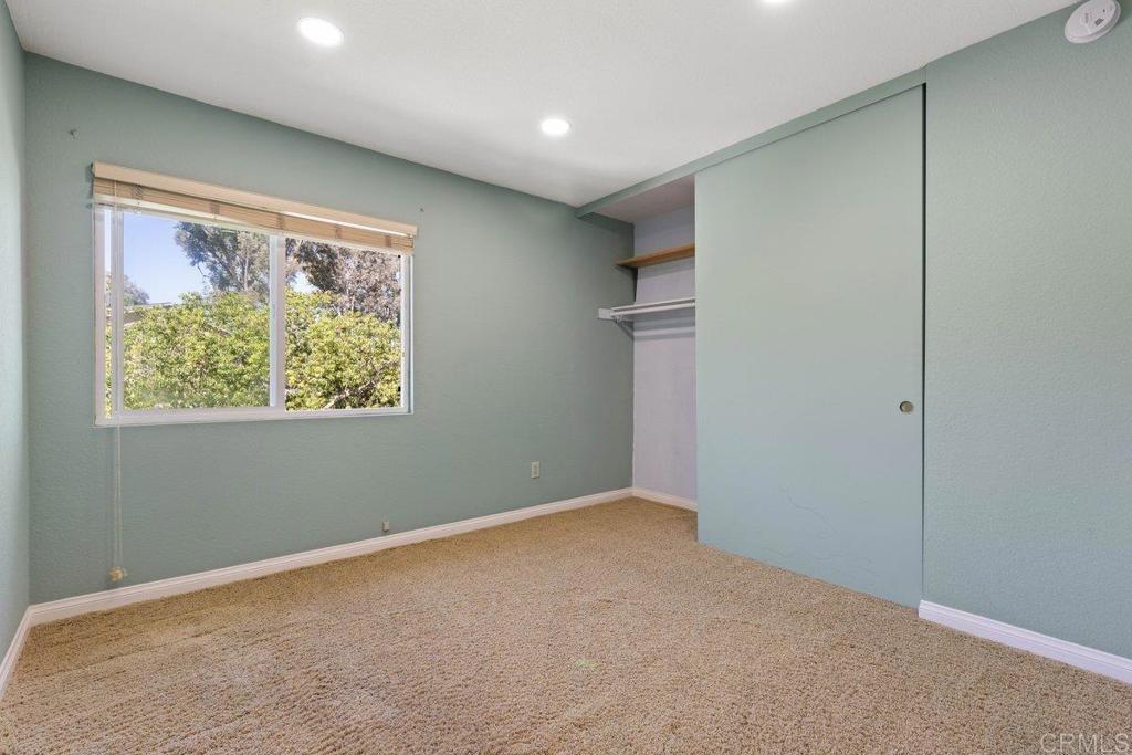 13544 Comuna Drive Poway, CA 92064 - Photo 19 of 41 an empty room with windows