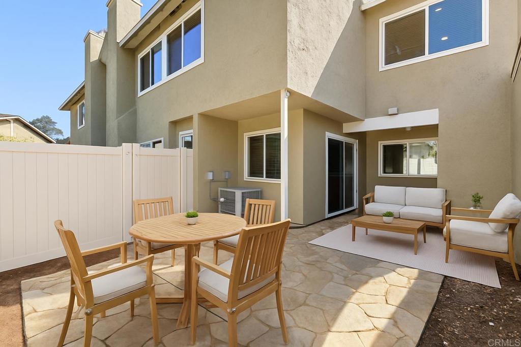 13544 Comuna Drive Poway, CA 92064 - Photo 29 of 41 a backyard of a house with a table and chairs