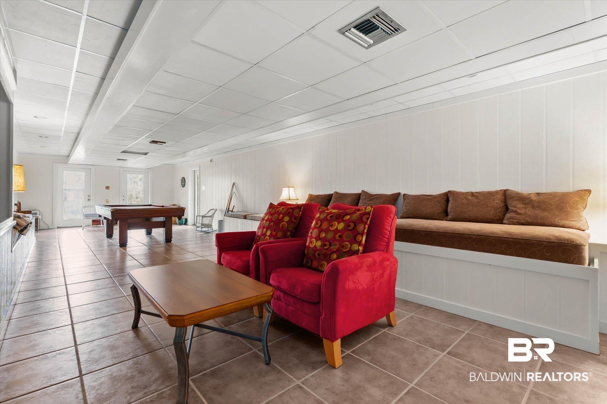 3500 Venetia Road Mobile, AL 36605 - Photo 34 of 56 Spacious multi-purpose room featuring tile flooring, white vertical plank paneling, and a drop ceiling