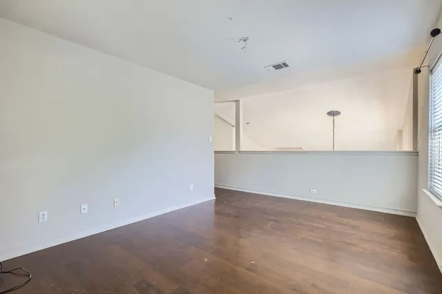 a view of a kitchen with a dishwasher and a refrigerator