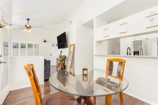 a dining room with furniture and window