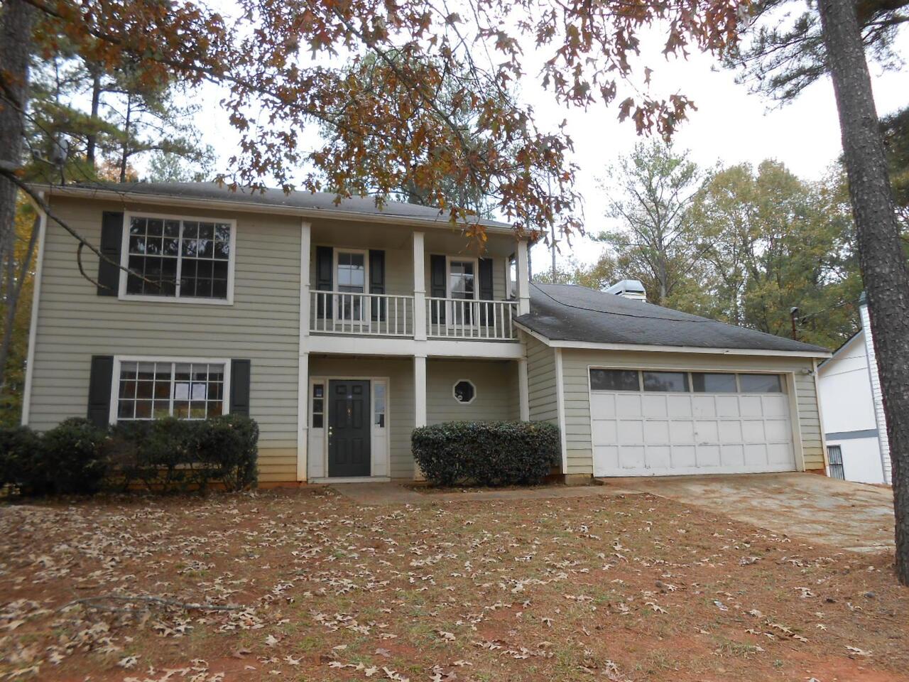 2831 Knollberry Lane Decatur, GA 30034 - Photo 1 of 1 a front view of a house with a yard and garage