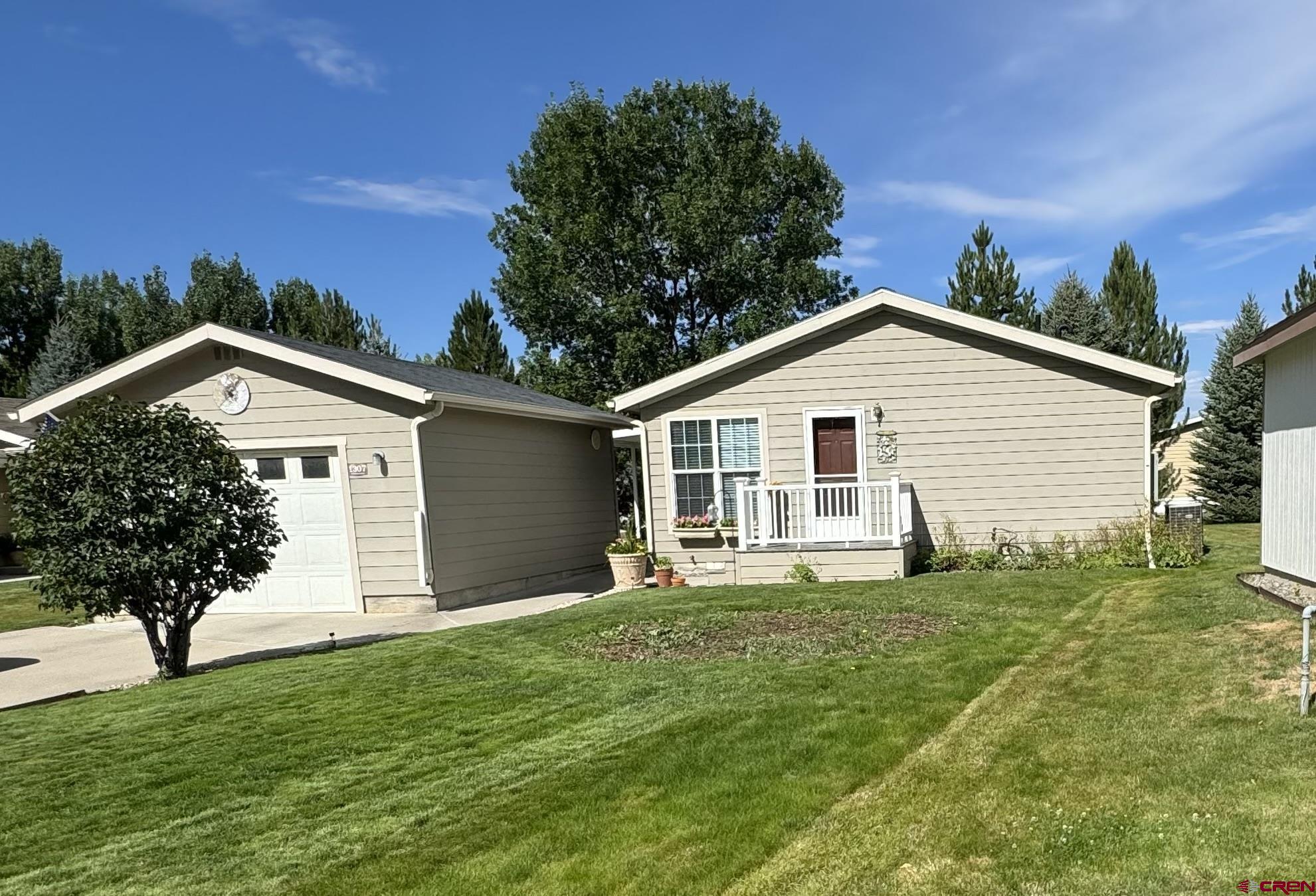 a view of a house with a yard