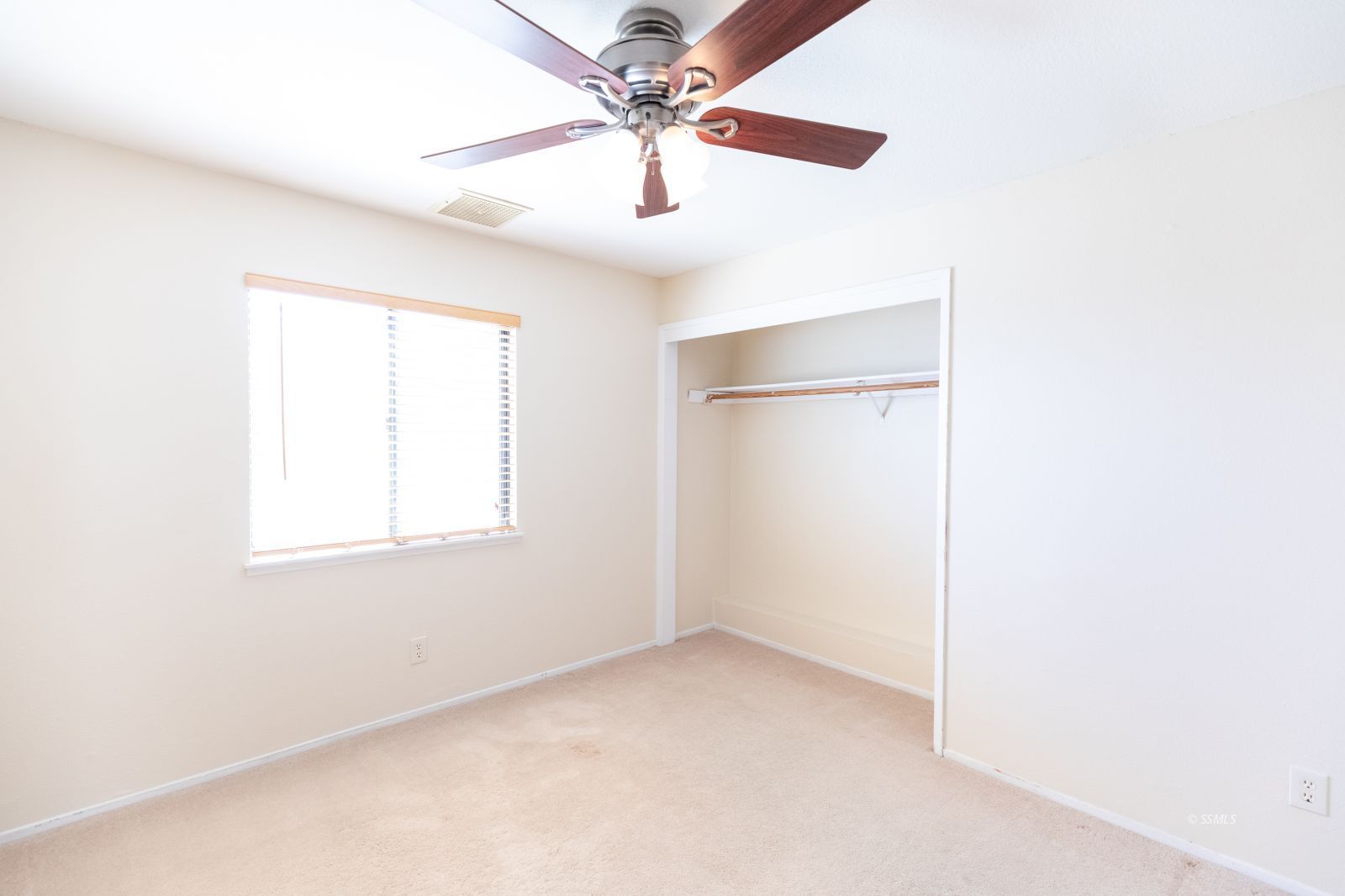 240 Richard Court Ridgecrest, CA 93555 - Photo 16 of 34 an empty room with a window and a fan