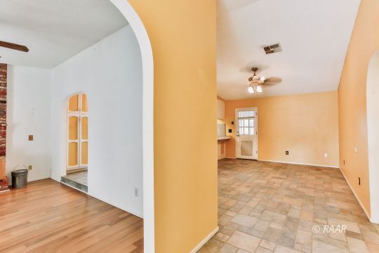 236 Richard Court Ridgecrest, CA 93555 - Photo 5 of 29 a view of a livingroom with wooden floor and a bathroom
