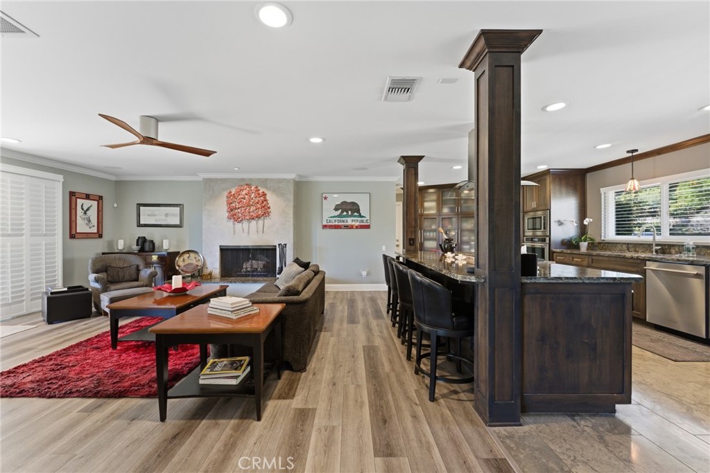 1805 Canyon Road Redlands, CA 92373 - Photo 14 of 61 a living room with dining room and wooden floor