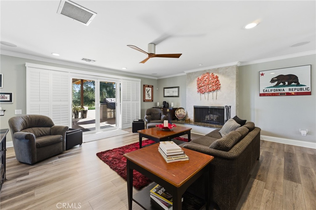 1805 Canyon Road Redlands, CA 92373 - Photo 17 of 61 a living room with furniture a fireplace and a flat screen tv