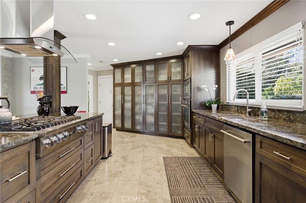 1805 Canyon Road Redlands, CA 92373 - Photo 20 of 61 a kitchen with stainless steel appliances granite countertop a sink stove and cabinets