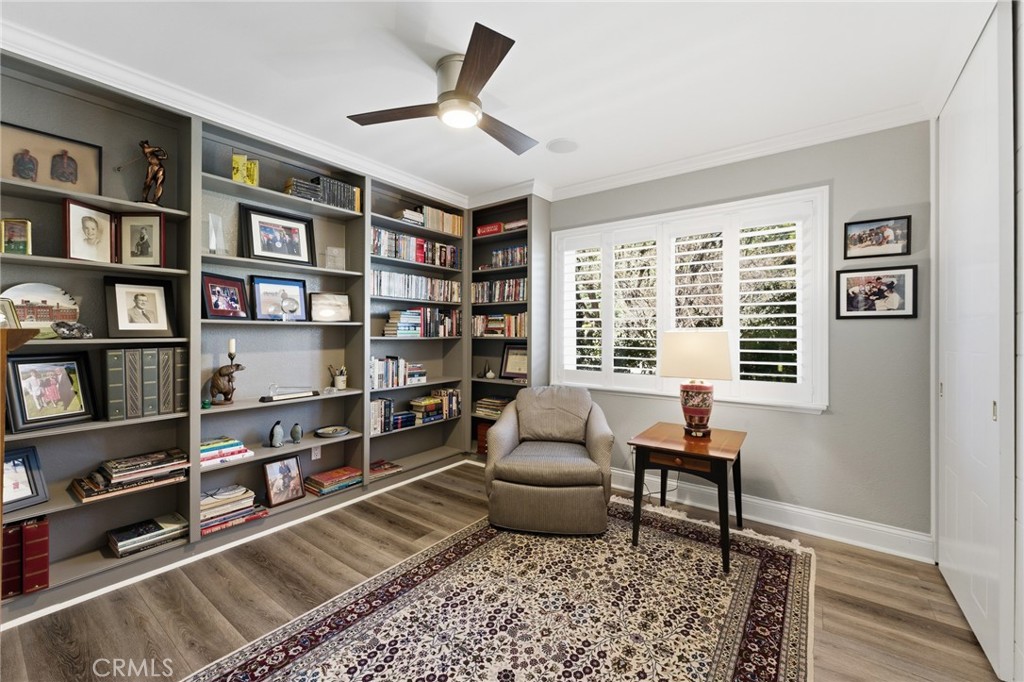 1805 Canyon Road Redlands, CA 92373 - Photo 24 of 61 a living room with furniture and a book shelf