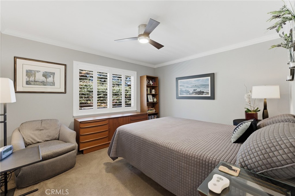 1805 Canyon Road Redlands, CA 92373 - Photo 25 of 61 a bedroom with a large bed couch and two window