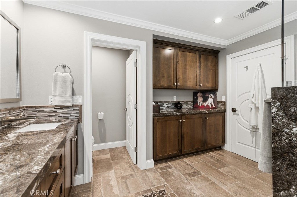 1805 Canyon Road Redlands, CA 92373 - Photo 33 of 61 a kitchen with granite countertop a stove and a refrigerator