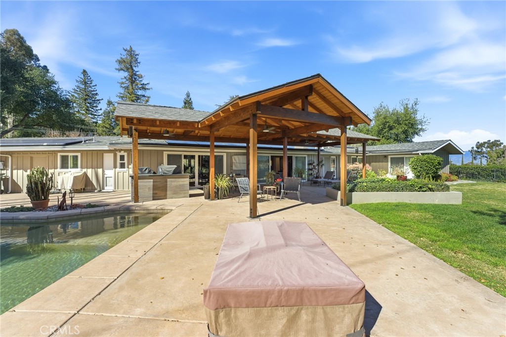 1805 Canyon Road Redlands, CA 92373 - Photo 50 of 61 a view of house with swimming pool and a yard