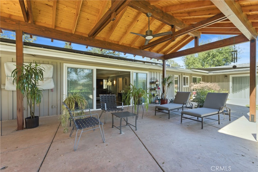1805 Canyon Road Redlands, CA 92373 - Photo 56 of 61 a view of a patio with a table and chairs under an umbrella