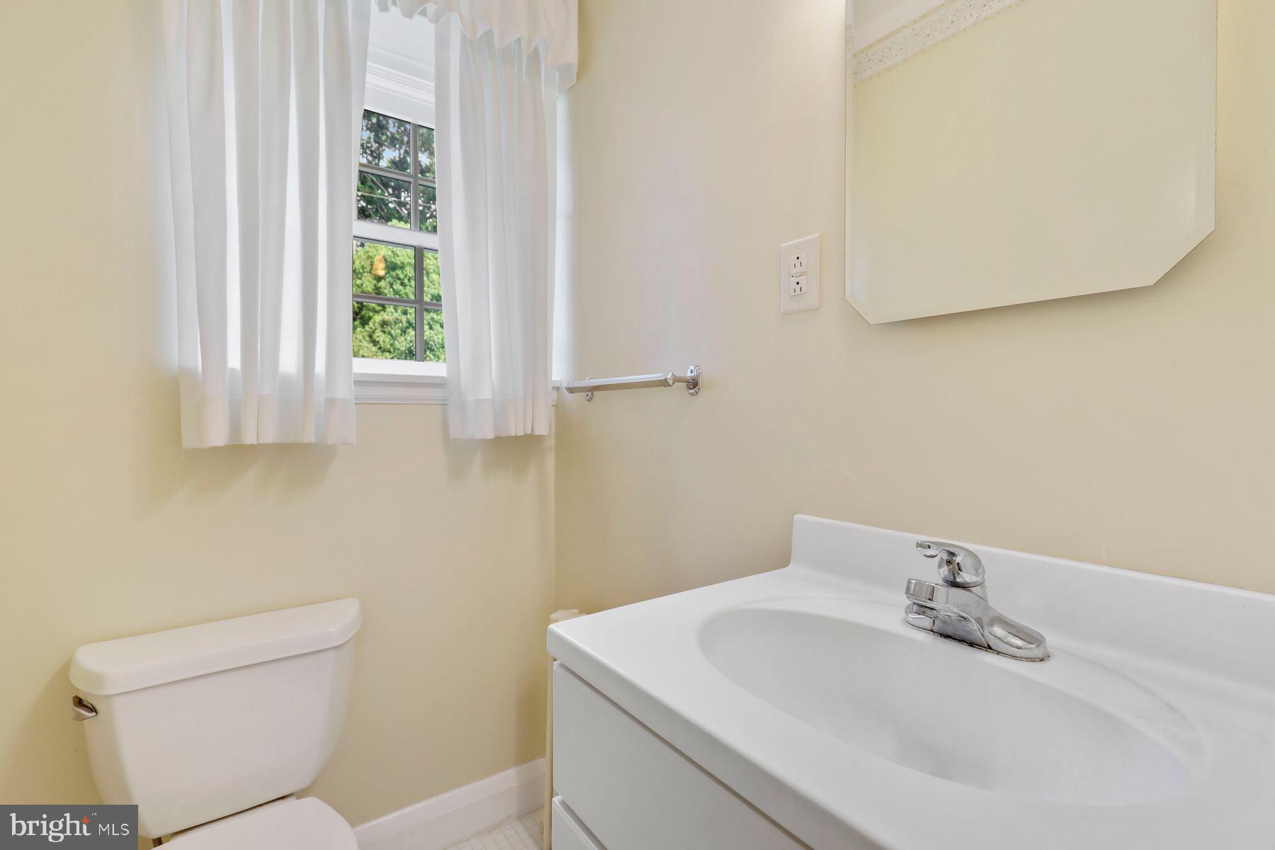 6301 Boxwood Road Baltimore, MD 21212 - Photo 15 of 37 Powder room at end of center hall