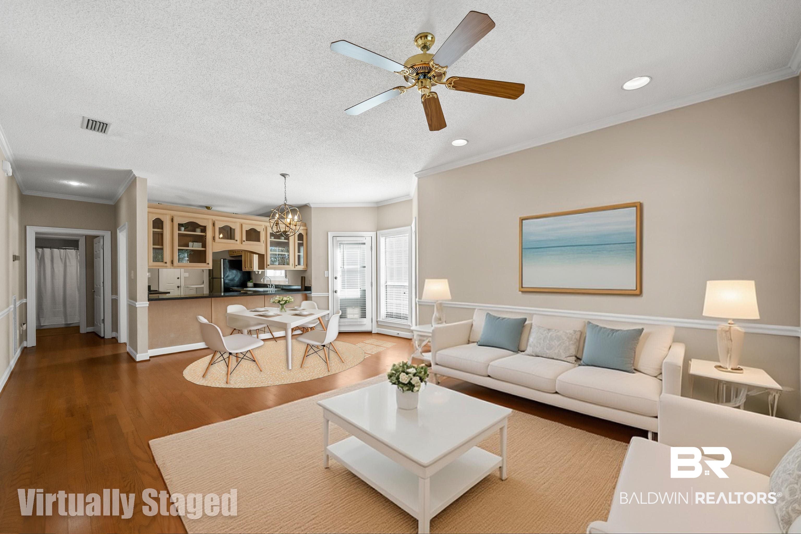 27 Cottage Drive Fairhope, AL 36532 - Photo 4 of 33 Virtually staged Living area with crown molding, a chandelier, wood finished floors, a textured ceiling, and a ceiling fan
