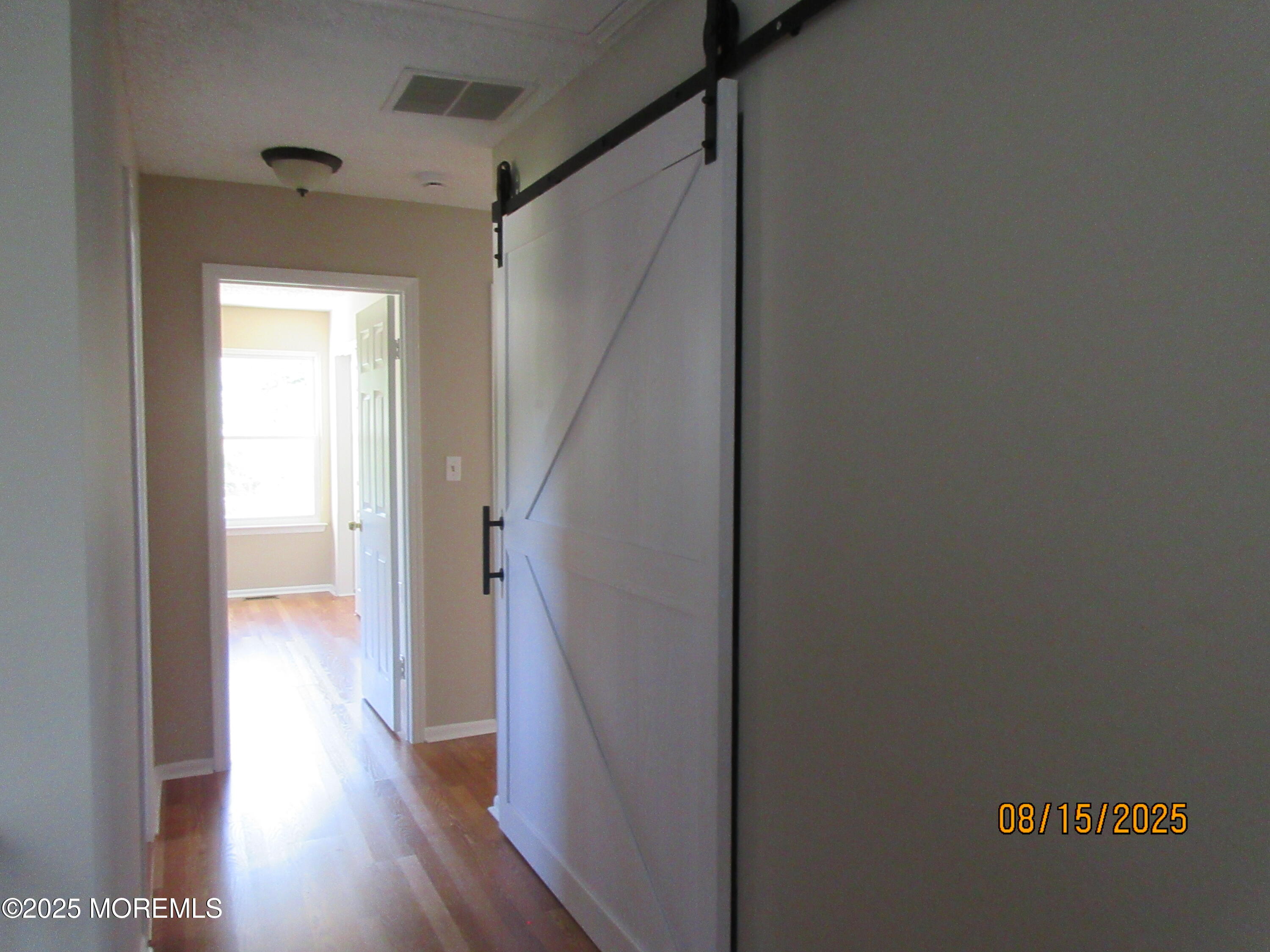 29 Longbrook Lane Freehold, NJ 07728 - Photo 15 of 40 a view of a hallway with wooden floor