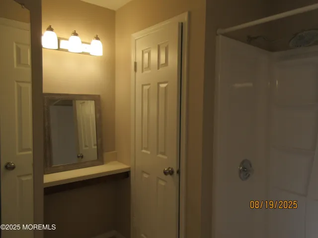 a bathroom with a mirror