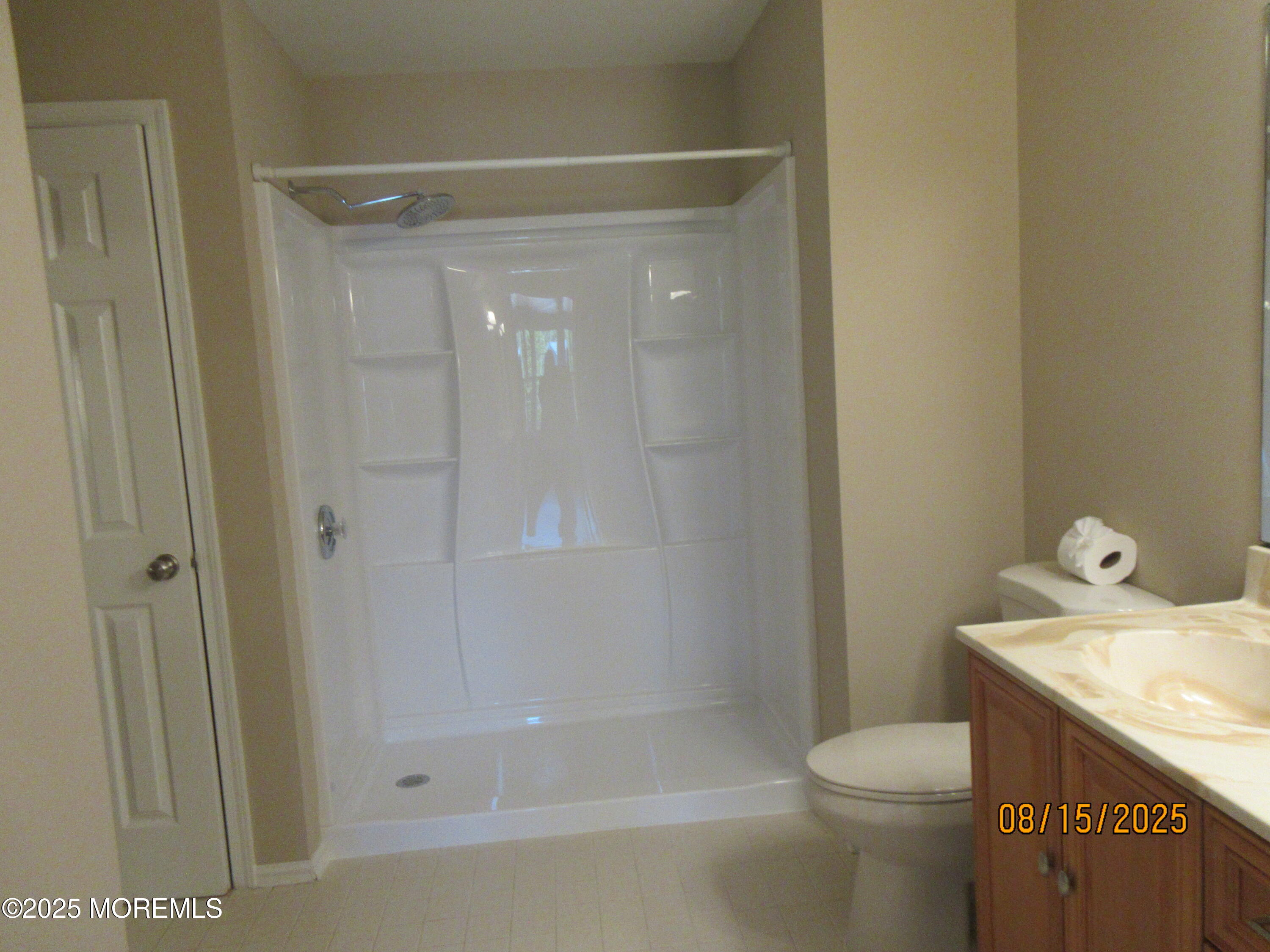 29 Longbrook Lane Freehold, NJ 07728 - Photo 22 of 40 a bathroom with a granite countertop sink a toilet and shower