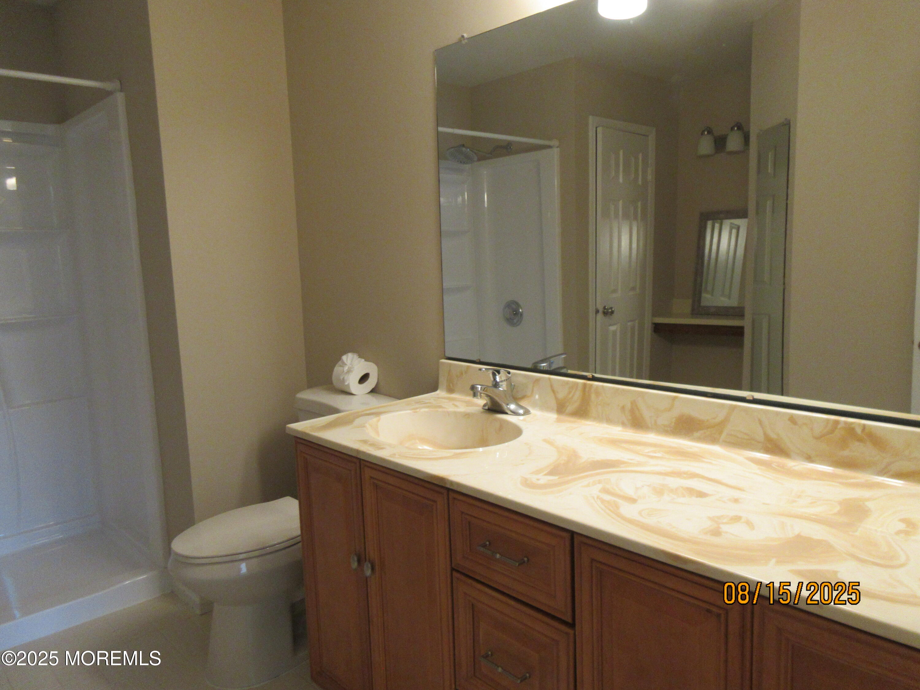 29 Longbrook Lane Freehold, NJ 07728 - Photo 23 of 40 a bathroom with a granite countertop sink toilet and mirror