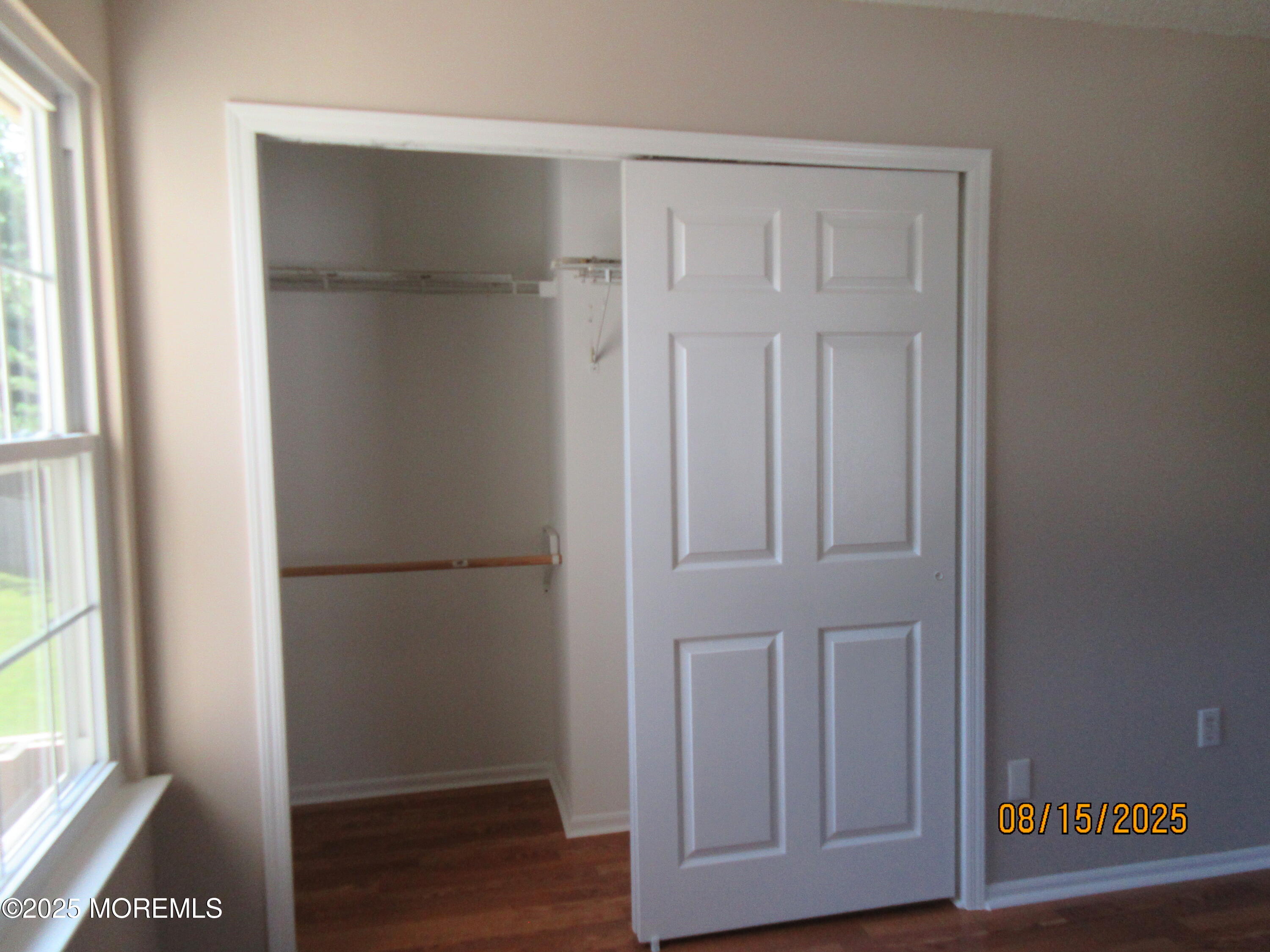 29 Longbrook Lane Freehold, NJ 07728 - Photo 26 of 40 a view of empty room with wooden floor and fan