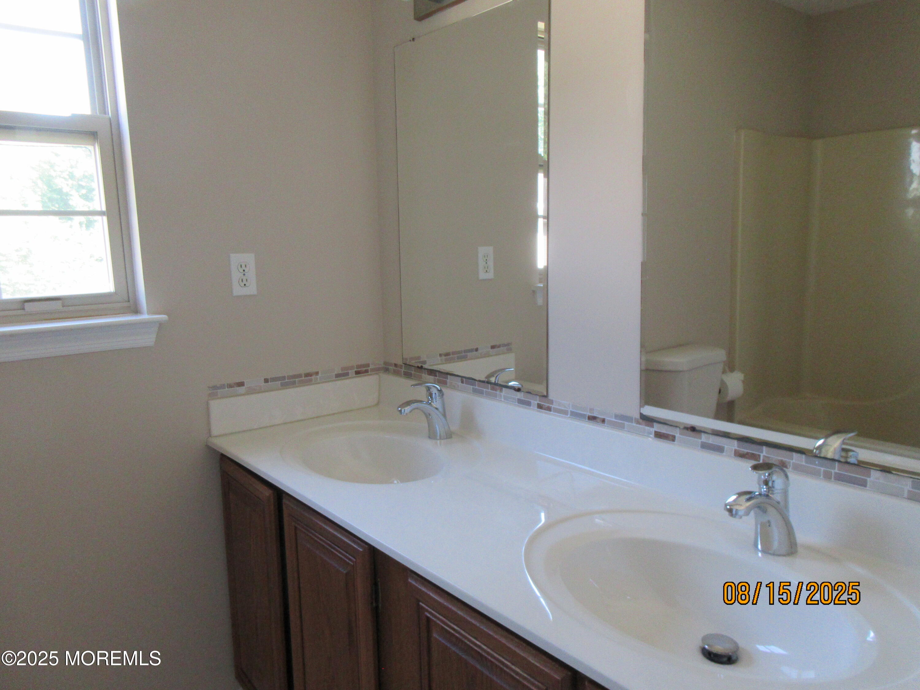 29 Longbrook Lane Freehold, NJ 07728 - Photo 29 of 40 a bathroom with a sink and a mirror