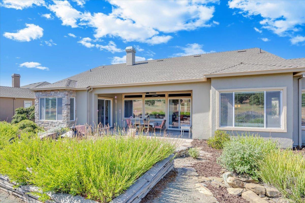 258 Rock Ridge Lane Copperopolis, CA 95228 - Photo 10 of 49 Backyard. All low maintenance. Covered patio, flagstone extended patio. Pathways, and natural landscaping.