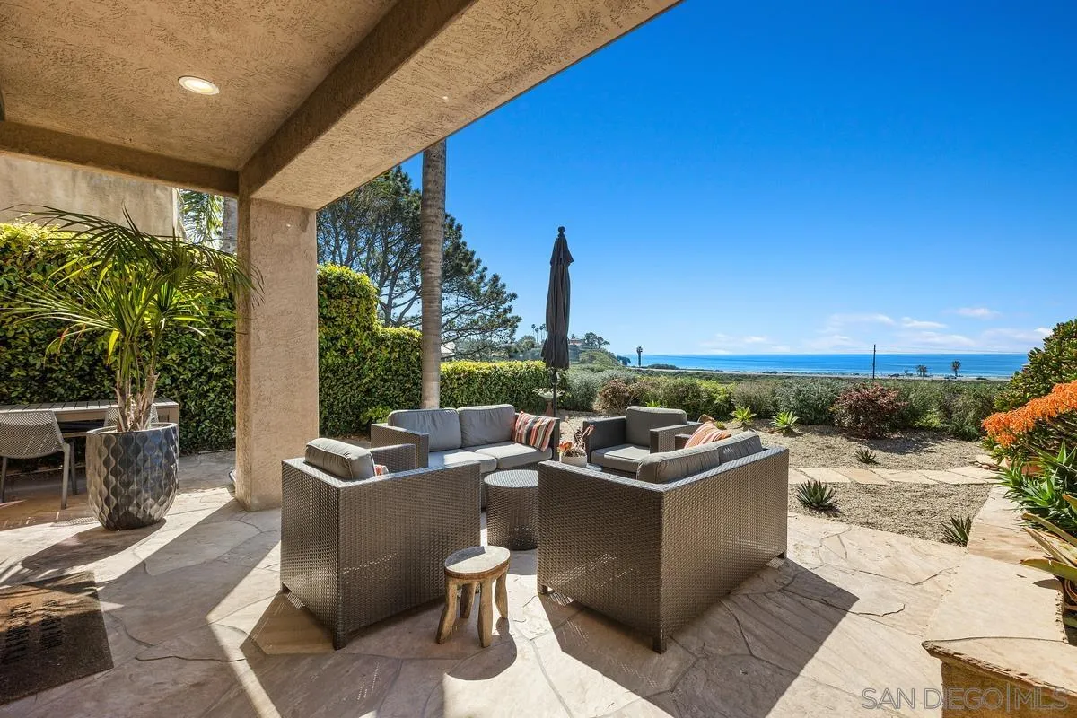 849 North Rios Avenue Solana Beach, CA 92075 - Photo 17 of 40 a view of a patio with couches and table and chairs and potted plants