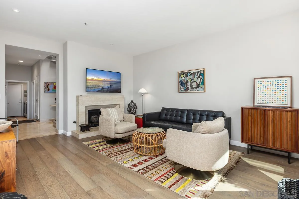849 North Rios Avenue Solana Beach, CA 92075 - Photo 19 of 40 a living room with furniture a fireplace and a flat screen tv