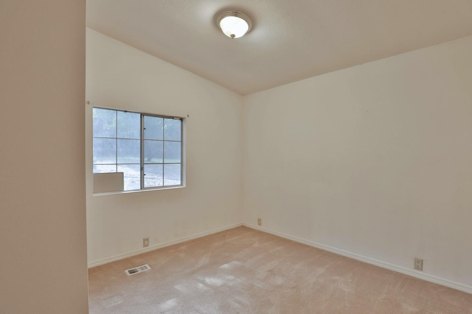 7277 Red Ant Road Somerset, CA 95684 - Photo 16 of 42 an empty room with windows