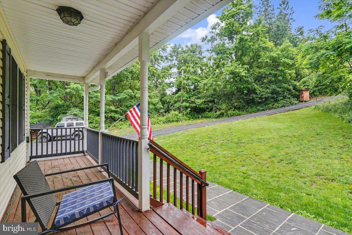 543 Whiskey Still Road Linden, VA 22642 - Photo 3 of 23 a view of a two chairs on the deck