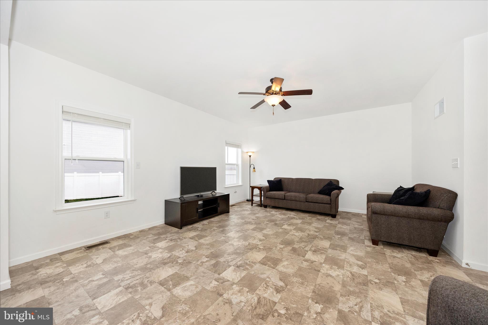 309 Eliza Road New Freedom, PA 17349 - Photo 15 of 57 a living room with furniture and a flat screen tv