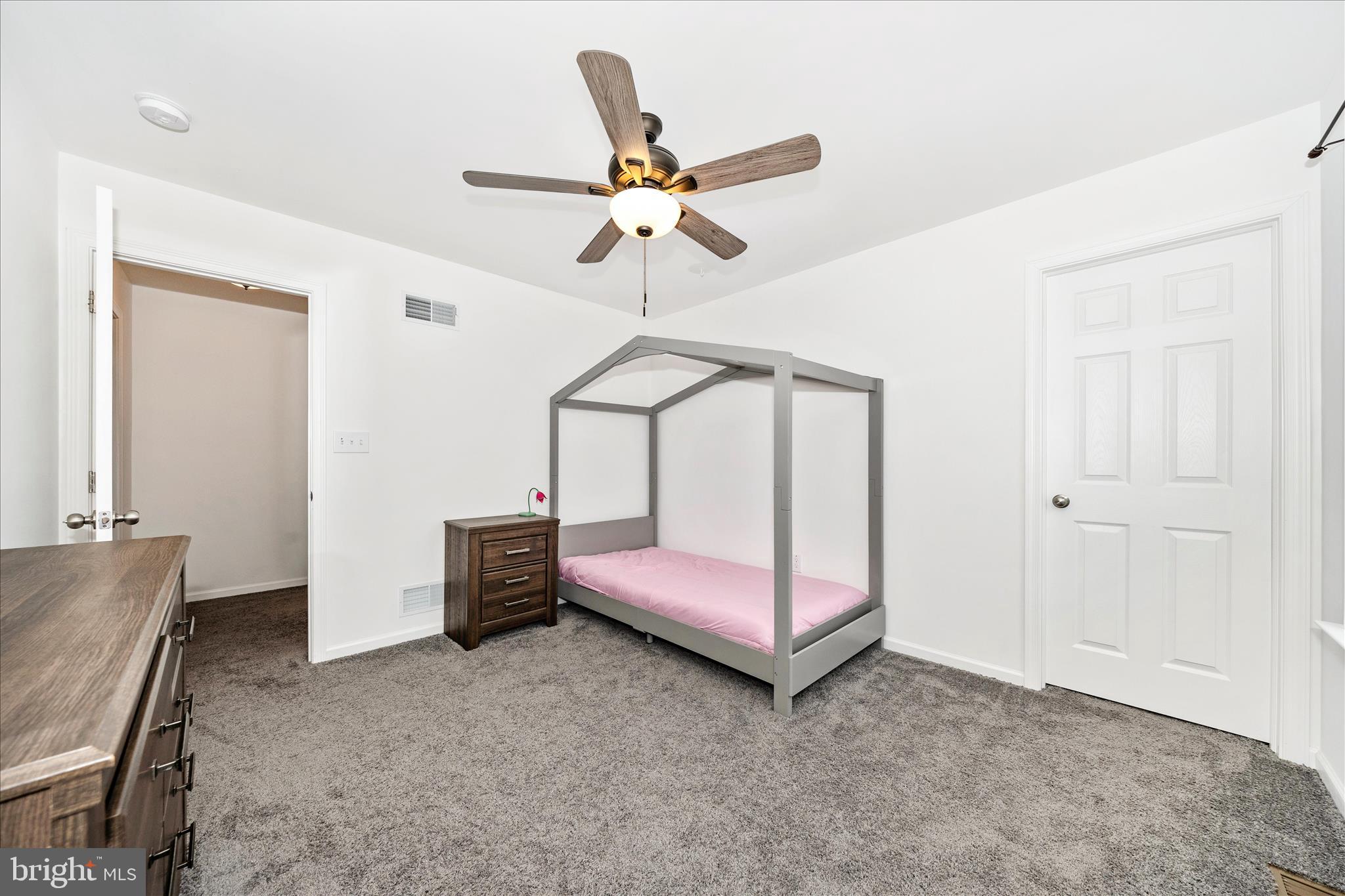 309 Eliza Road New Freedom, PA 17349 - Photo 28 of 57 a bedroom with a bed and a chandelier