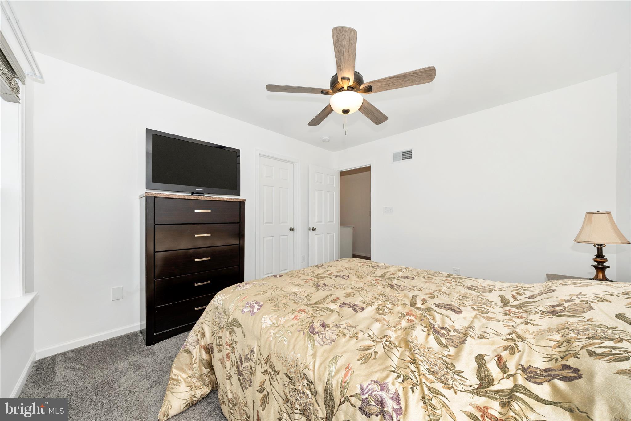 309 Eliza Road New Freedom, PA 17349 - Photo 32 of 57 a bedroom with a bed and a flat screen tv