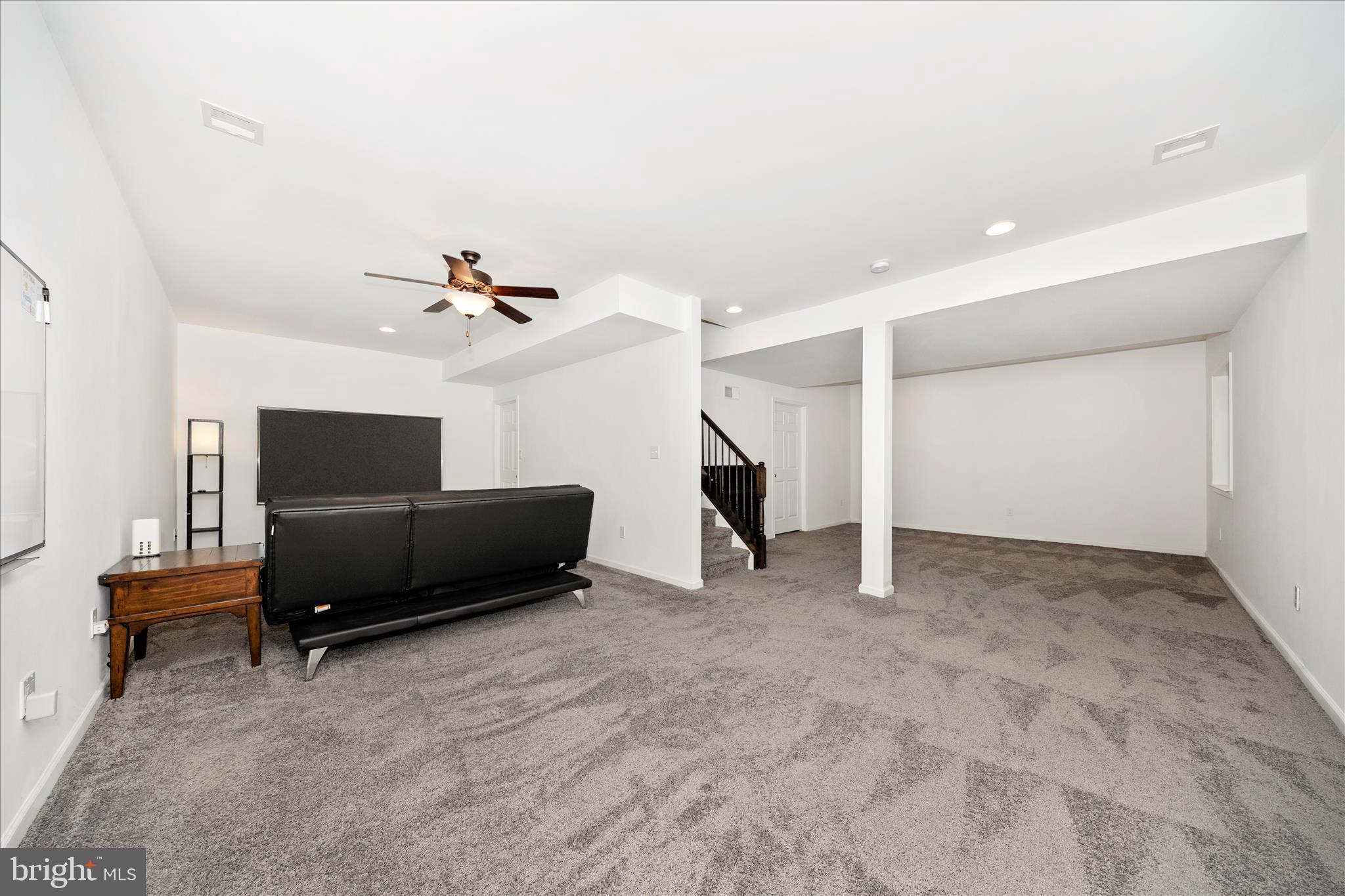 309 Eliza Road New Freedom, PA 17349 - Photo 36 of 57 a living room with furniture and a ceiling fan