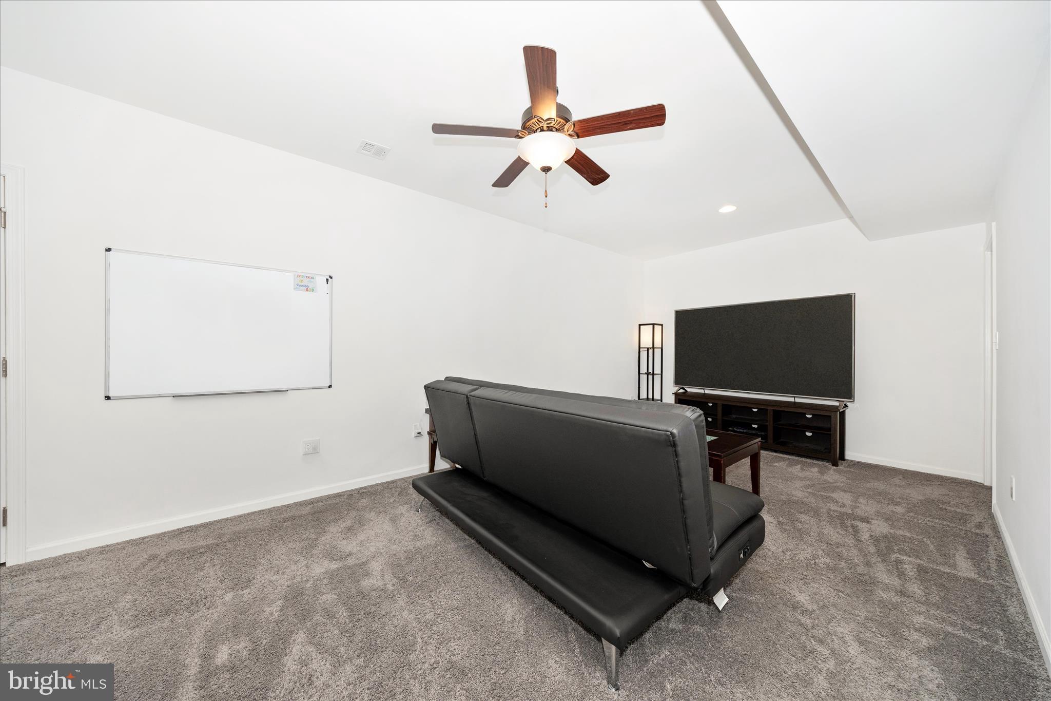 309 Eliza Road New Freedom, PA 17349 - Photo 37 of 57 a living room with furniture and a flat screen tv