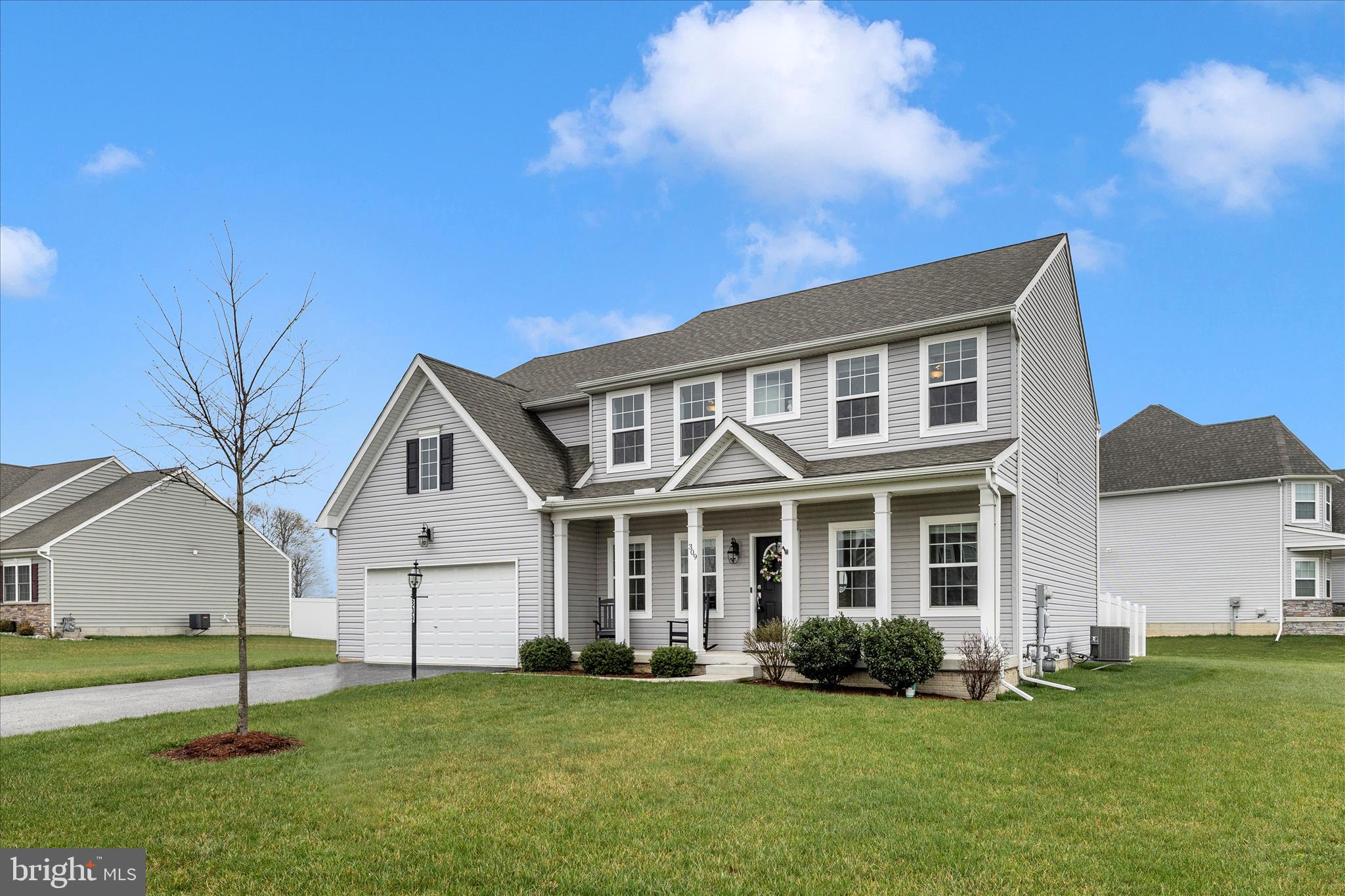 309 Eliza Road New Freedom, PA 17349 - Photo 41 of 57 a front view of a house with a garden