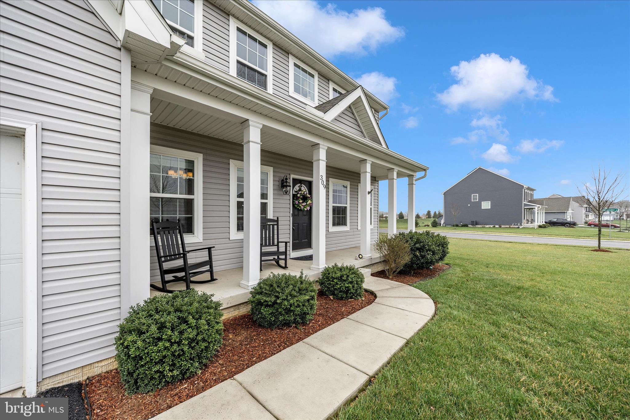 309 Eliza Road New Freedom, PA 17349 - Photo 42 of 57 a front view of a house with garden