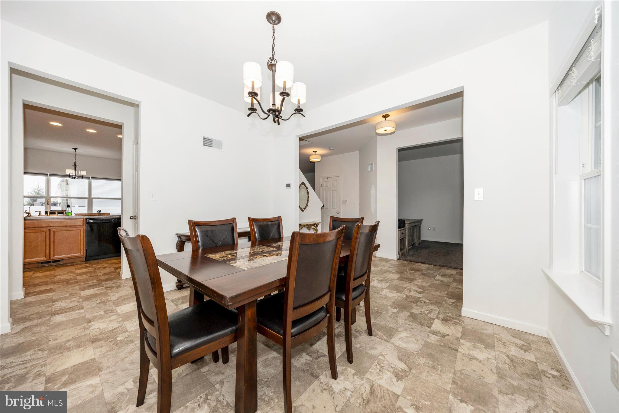 309 Eliza Road New Freedom, PA 17349 - Photo 7 of 57 a view of a dining room with furniture and chandelier