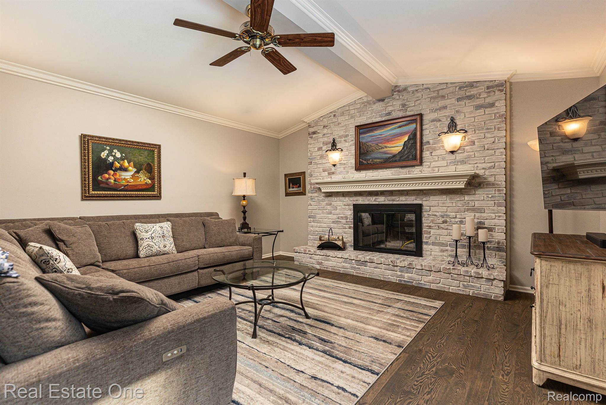 11700 Raintree Court Utica, MI 48315 - Photo 9 of 35 Family room focal point is the natural fireplace