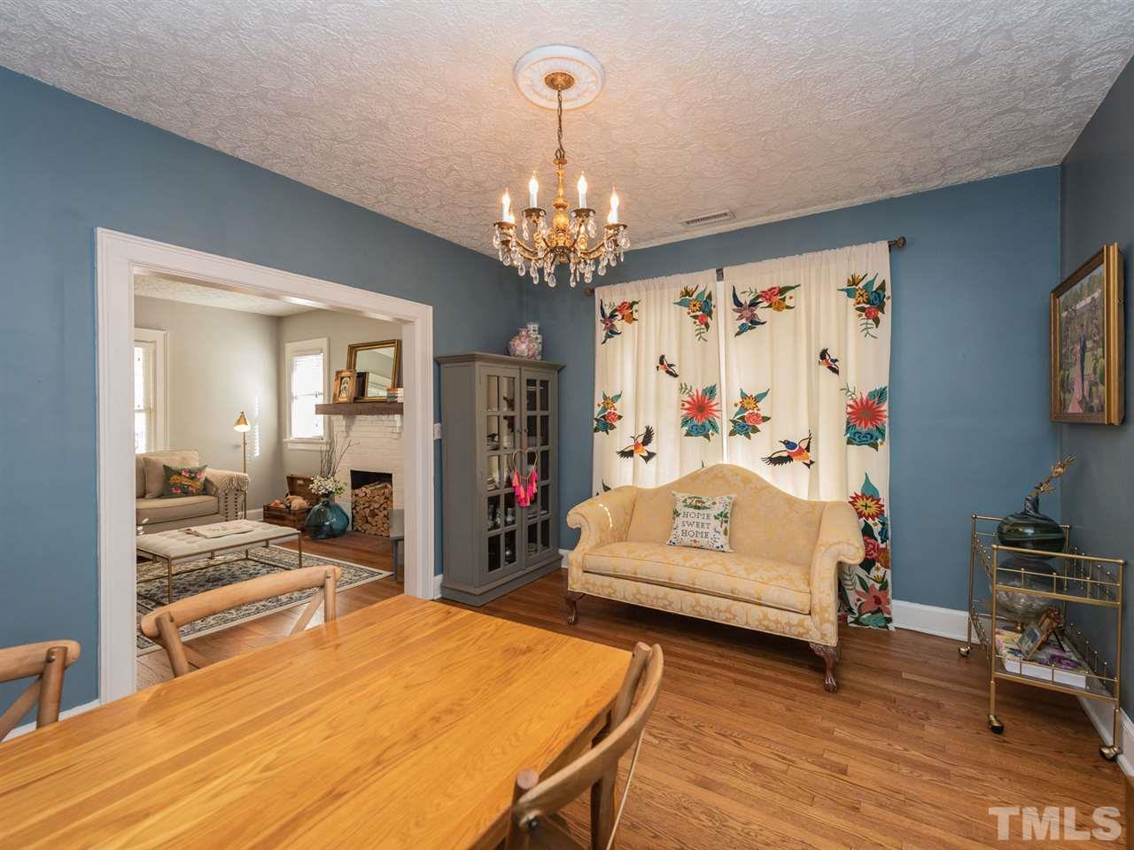 612 North Boundary Street Raleigh, NC 27604 - Photo 13 of 28 a bedroom with furniture and a chandelier