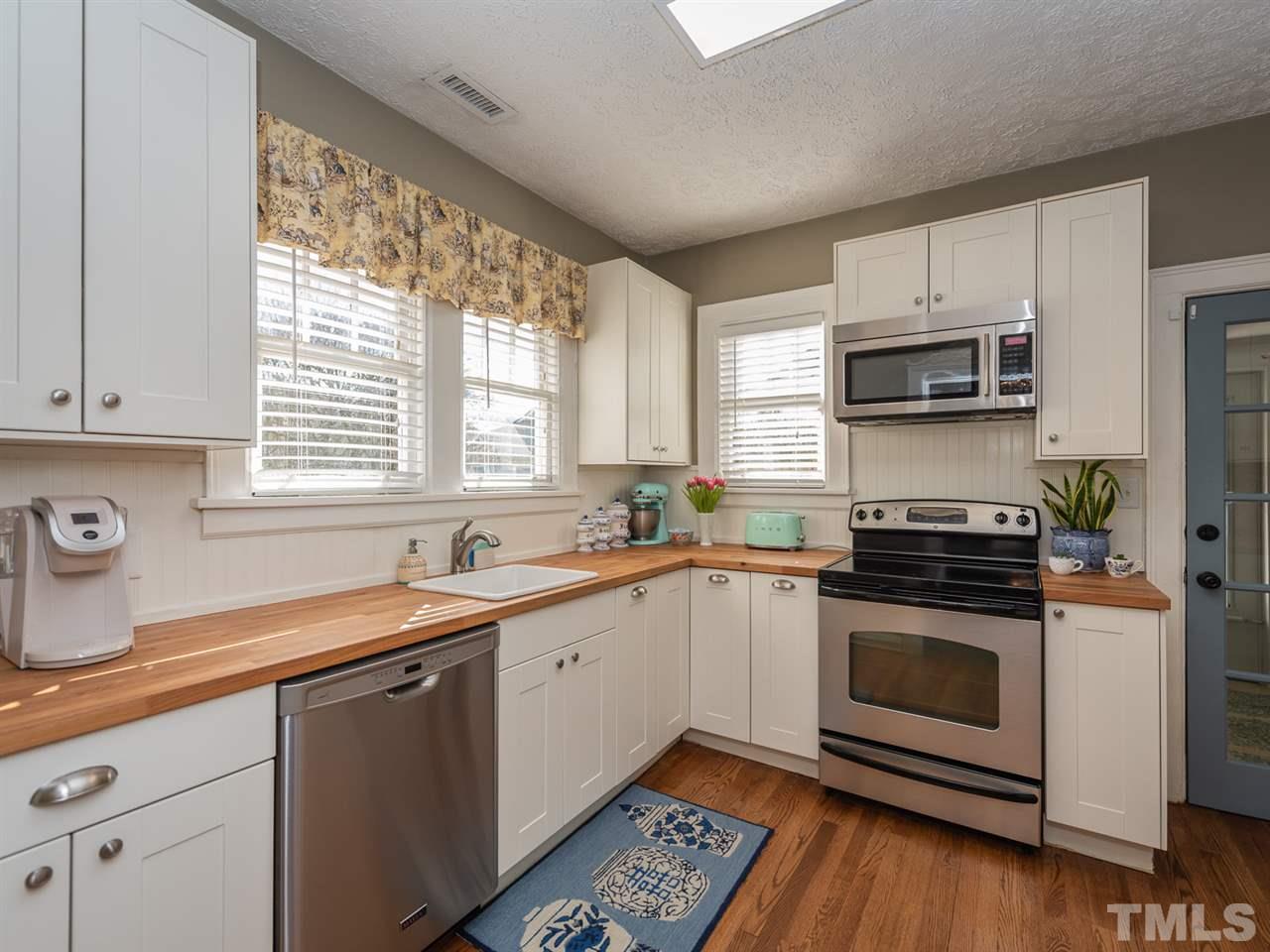 612 North Boundary Street Raleigh, NC 27604 - Photo 14 of 28 a kitchen with a sink stove and microwave