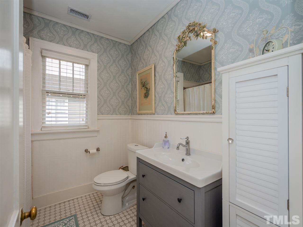 612 North Boundary Street Raleigh, NC 27604 - Photo 18 of 28 a bathroom with a sink toilet and mirror